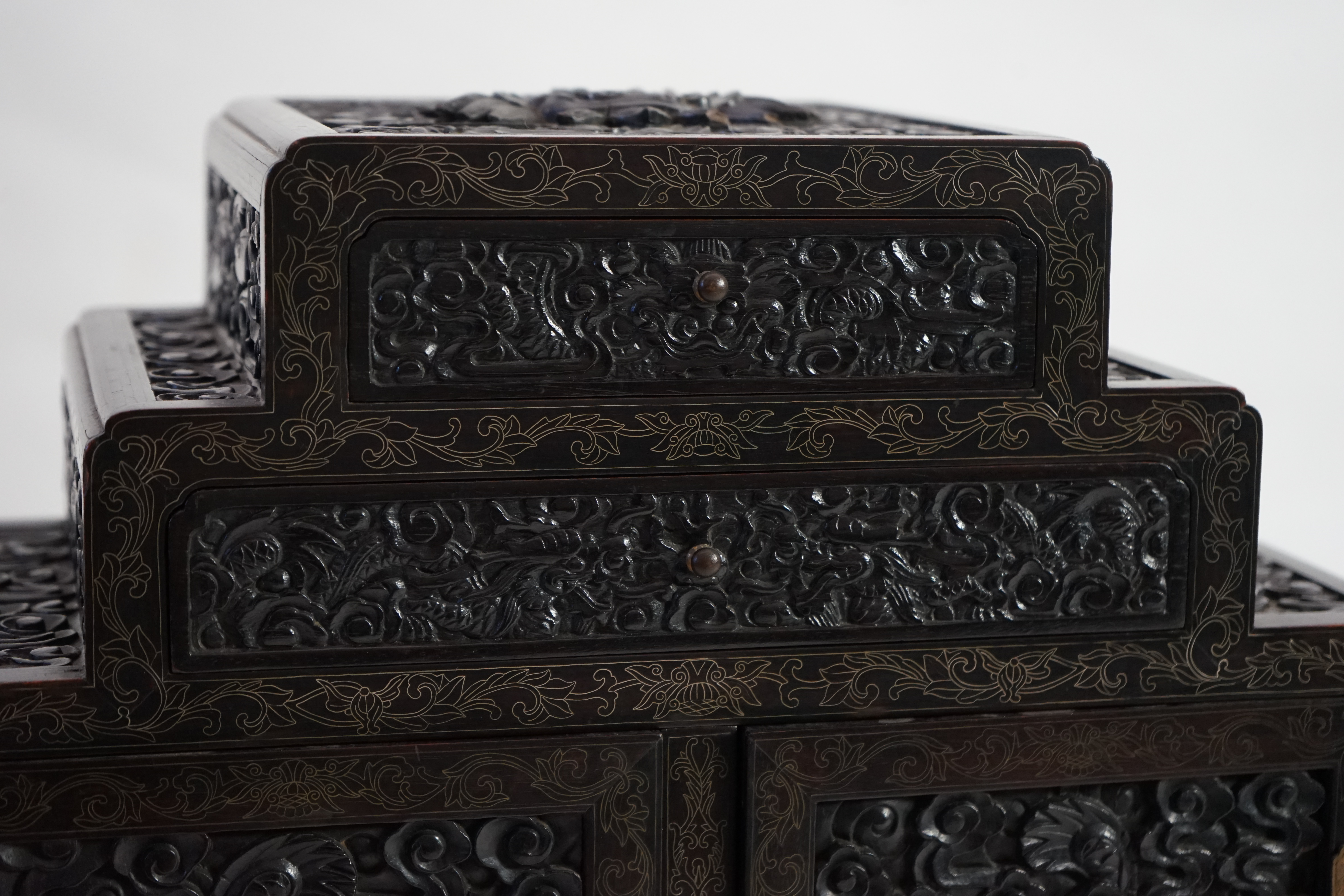 An important pair of Chinese carved zitan and silver wire inlaid ‘cloud and dragon’ curio cabinets and stands, duobaoge, probably Imperial, late Qing dynasty